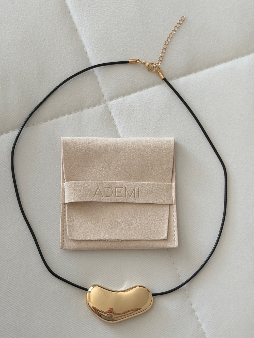 Gold-tone Bean Pendant Necklace with Black Cord